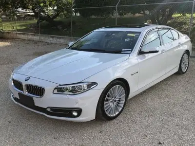 White BMW sedan in the Jamare Tours fleet
