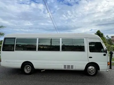 White Coaster bus in the Jamare Tours fleet